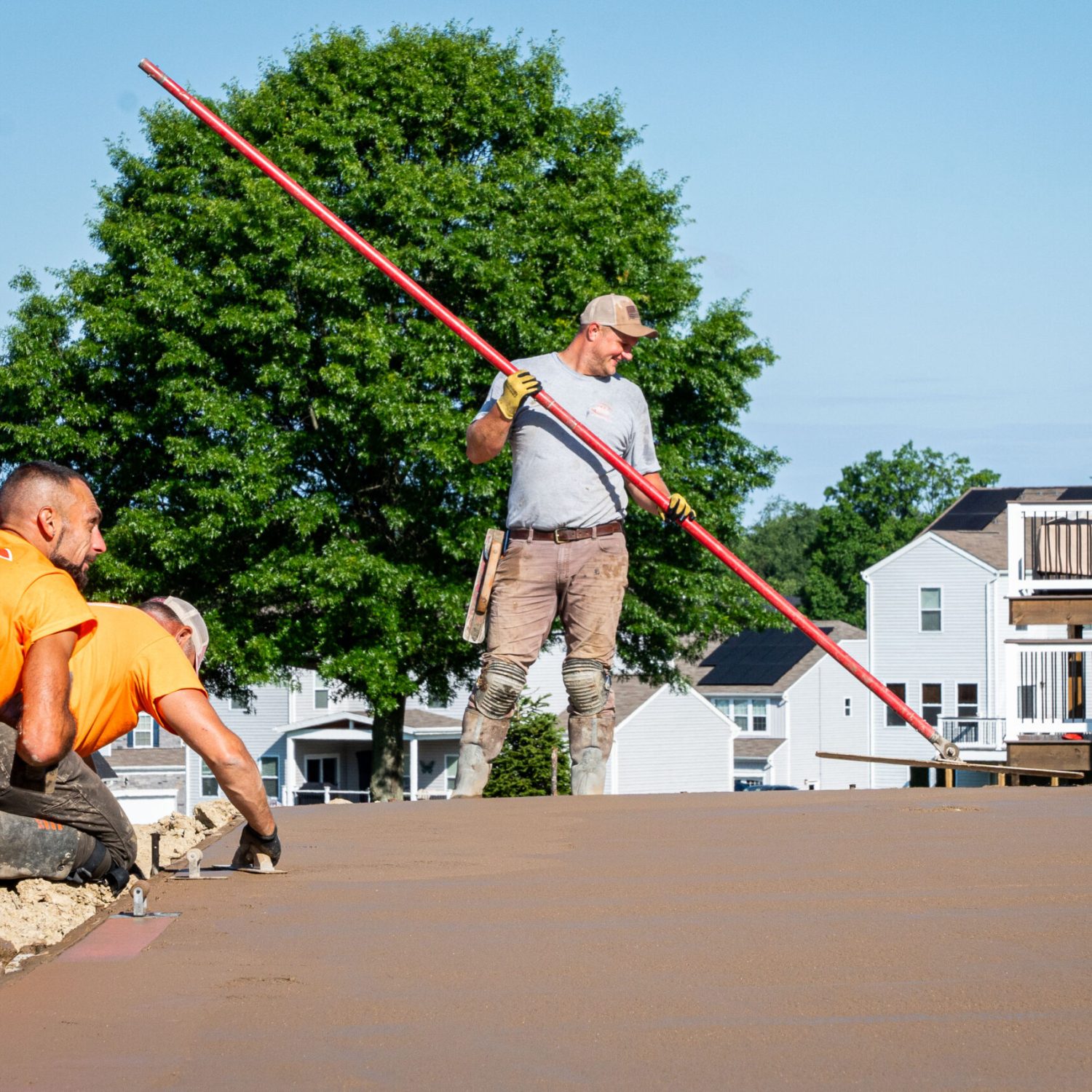 Construction Workers at Stamped Concrete Pool Deck